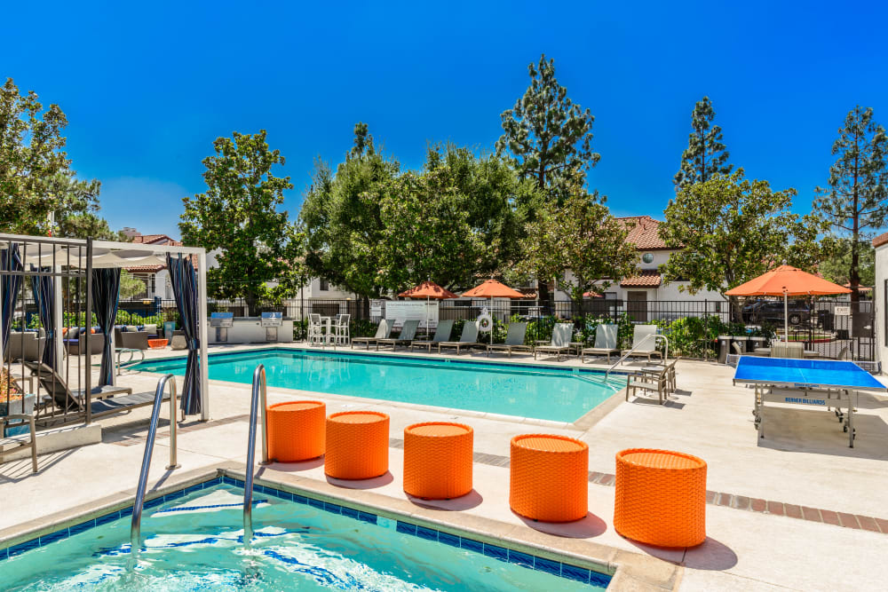 Hot tub with comfortable seating next to it at Sonora at Alta Loma in Alta Loma, California