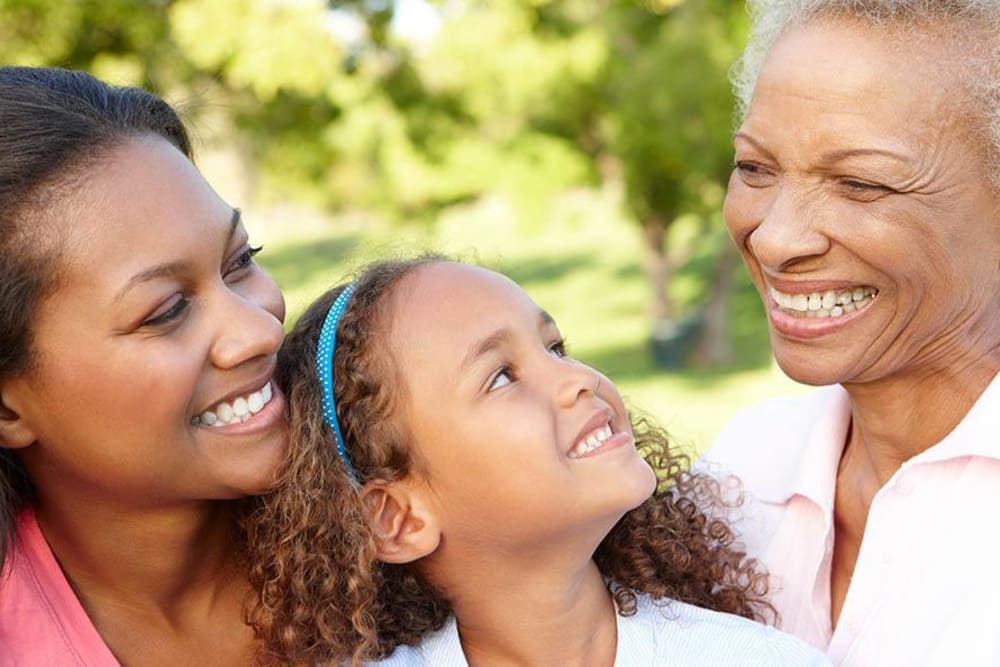 Happy resident and her family at WellQuest of Menifee Lakes in Menifee, California