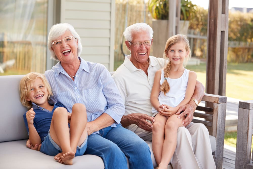 Happy residents with their grandchildren at WellQuest of Menifee Lakes in Menifee, California