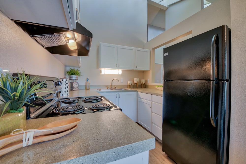 Kitchen with nice counters at Lakeside Landing Apartments in Tacoma, Washington