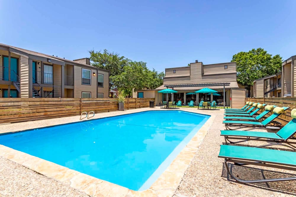Sparkling blue pool at Sausalito Apartments in College Station, Texas