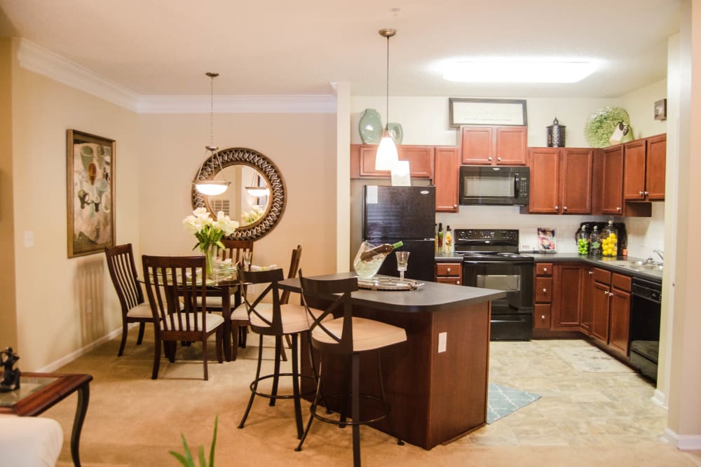 Kitchen with bar style seating at Lullwater at Saluda Pointe in Lexington, South Carolina