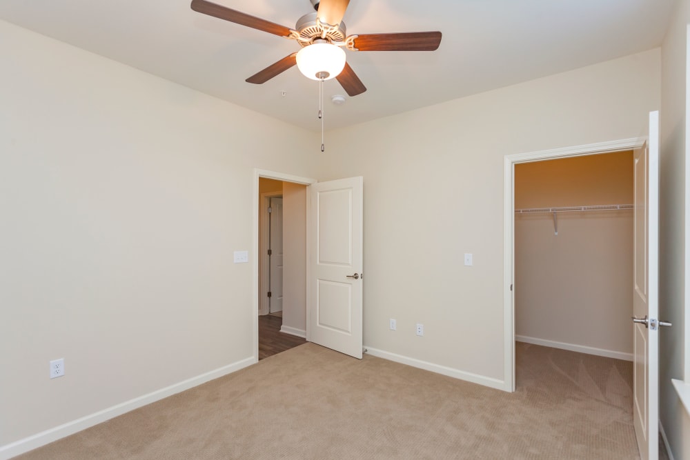 Bedroom with a ceiling fan at Madison Crest Apartment Homes in Madison, Tennessee