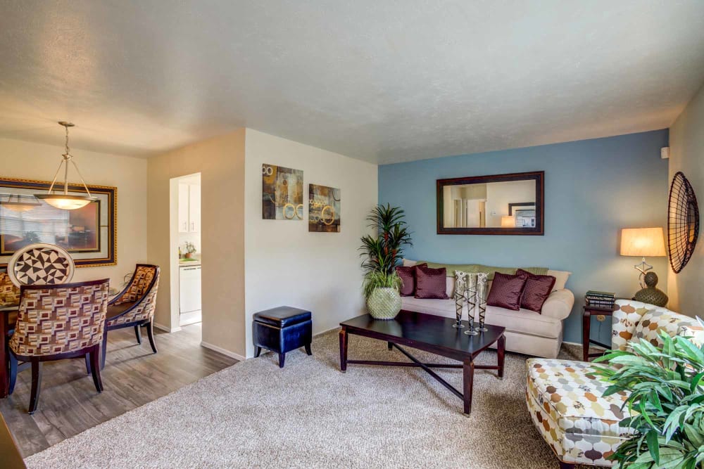 Living room and dining nook at Willow Oaks Apartments in Bryan, Texas