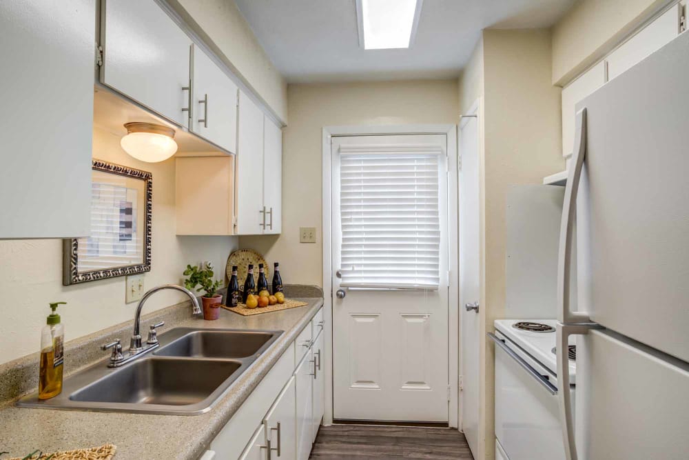 Well-equipped kitchen at Willow Oaks Apartments in Bryan, Texas