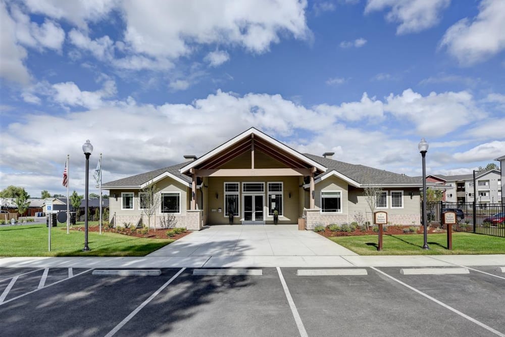 Leasing office surround by a beautifully manicured lawn at LARC at Kent in Kent, Washington