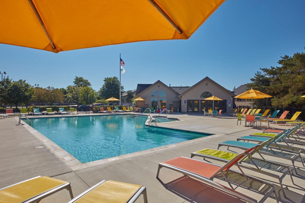 View of the swimming pool from a shaded patio table at Lakeside Terraces in Sterling Heights, Michigan