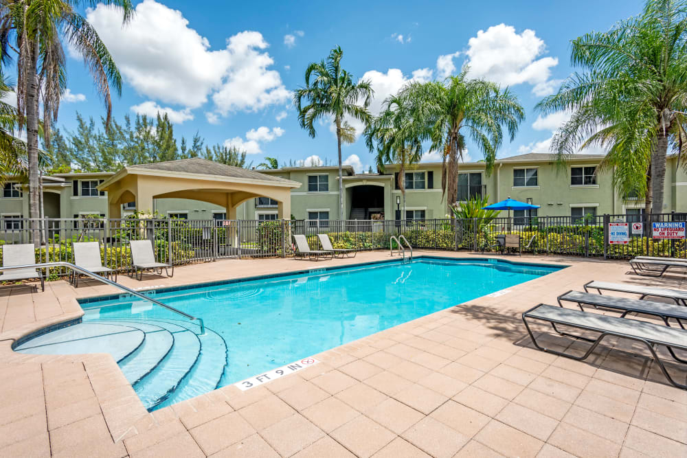 A beautifully resort-style swimming pool at Emerald Dunes Apartments in Miami Gardens, Florida