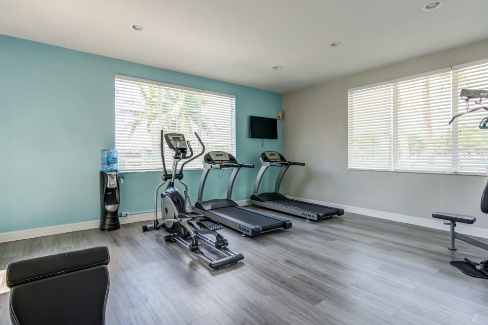 A clean fitness center at Cedar Grove Apartments in Miami Gardens, Florida