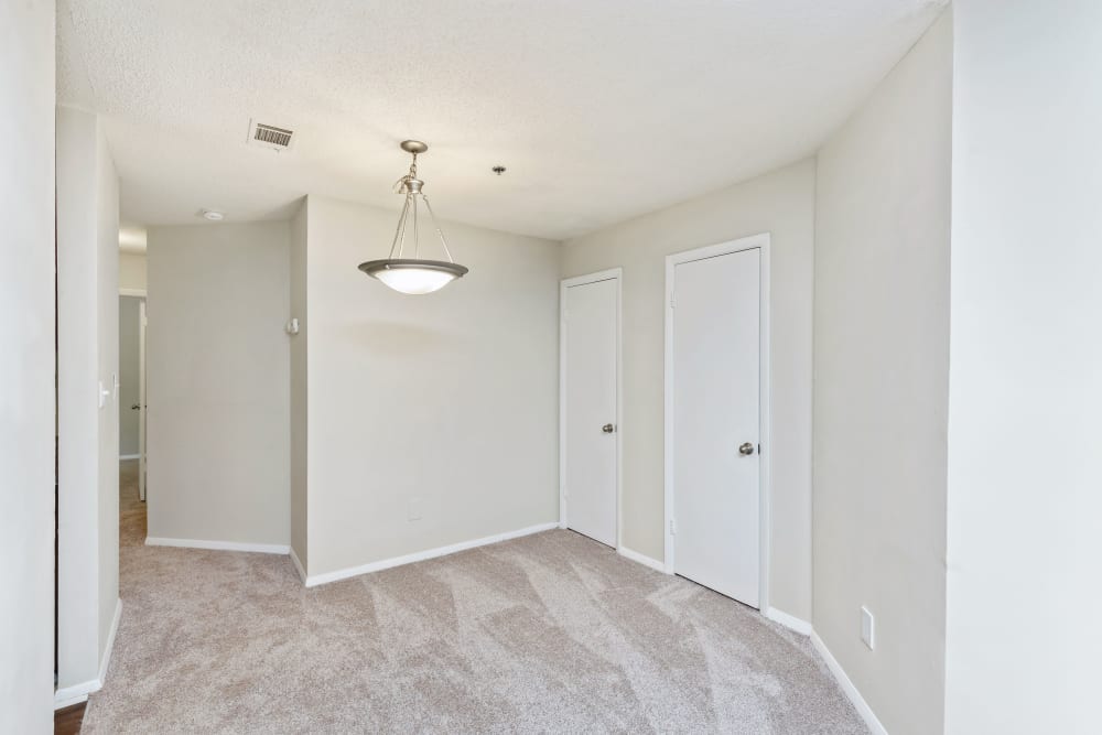 Bedroom with plush carpeting at Austell Village Apartment Homes in Austell, Georgia