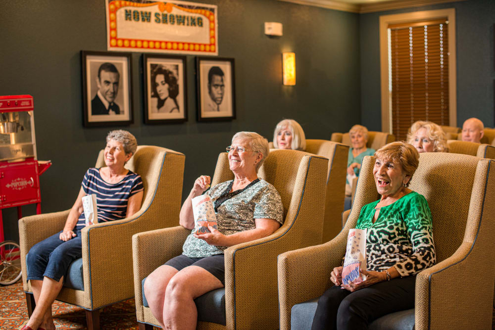Residents enjoying a movie at an Integrated Senior Lifestyles community