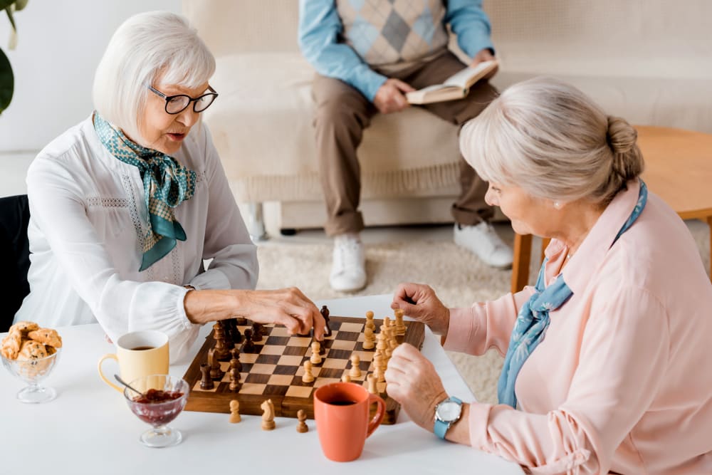 Two residents playing chess at a Keystone community