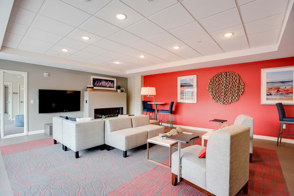 A spacious clubhouse with a flat-screen TV for watching sports at Lake Jonathan Flats in Chaska, Minnesota