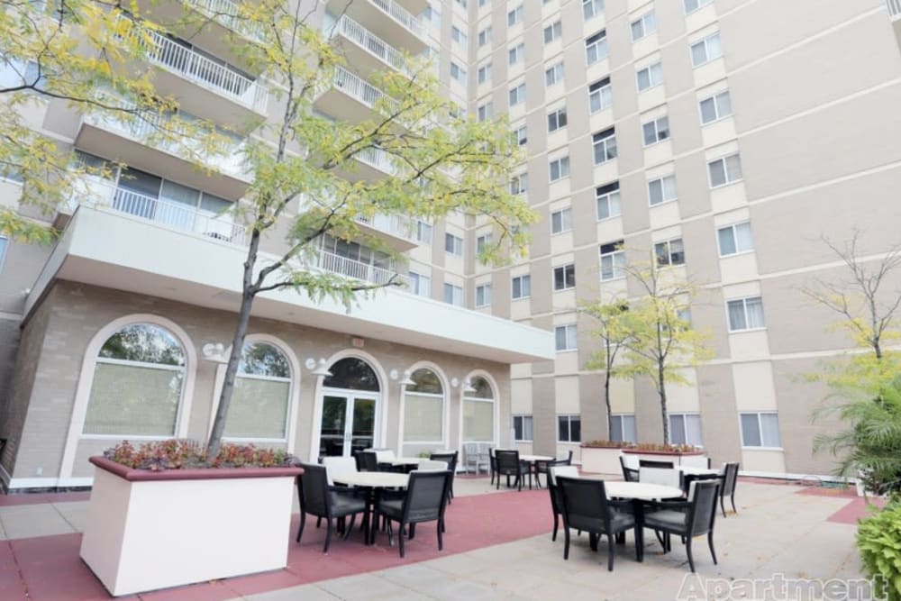 A clubhouse patio with plenty of seating Westwood Tower Apartments in Bethesda, Maryland