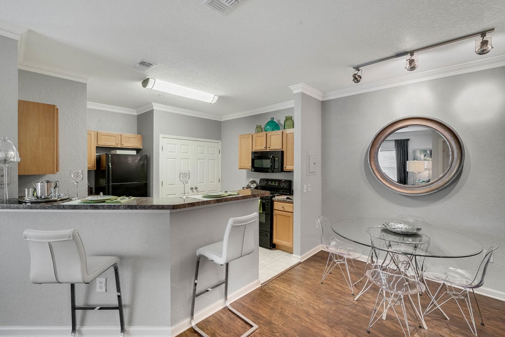 Kitchen bar with chairs in model apartment at Palms at World Gateway in Orlando, Florida
