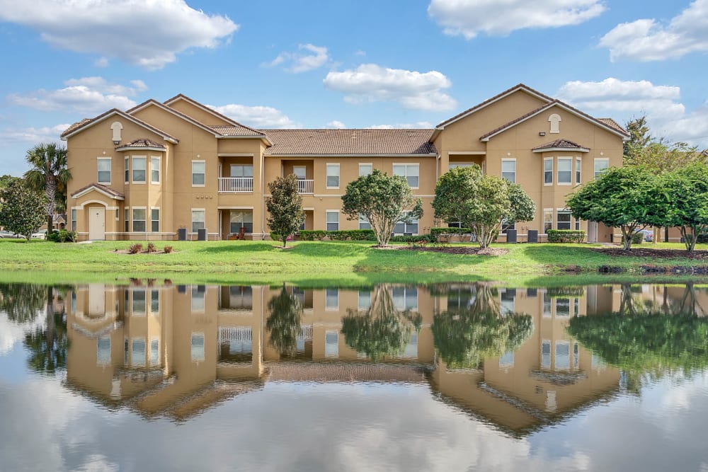 Exterior of Palms at World Gateway with the reflection in a lake in Orlando, Florida