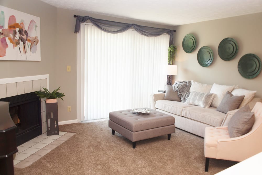 Living room featuring a fireplace at Fox Chase Apartments in Cincinnati, Ohio