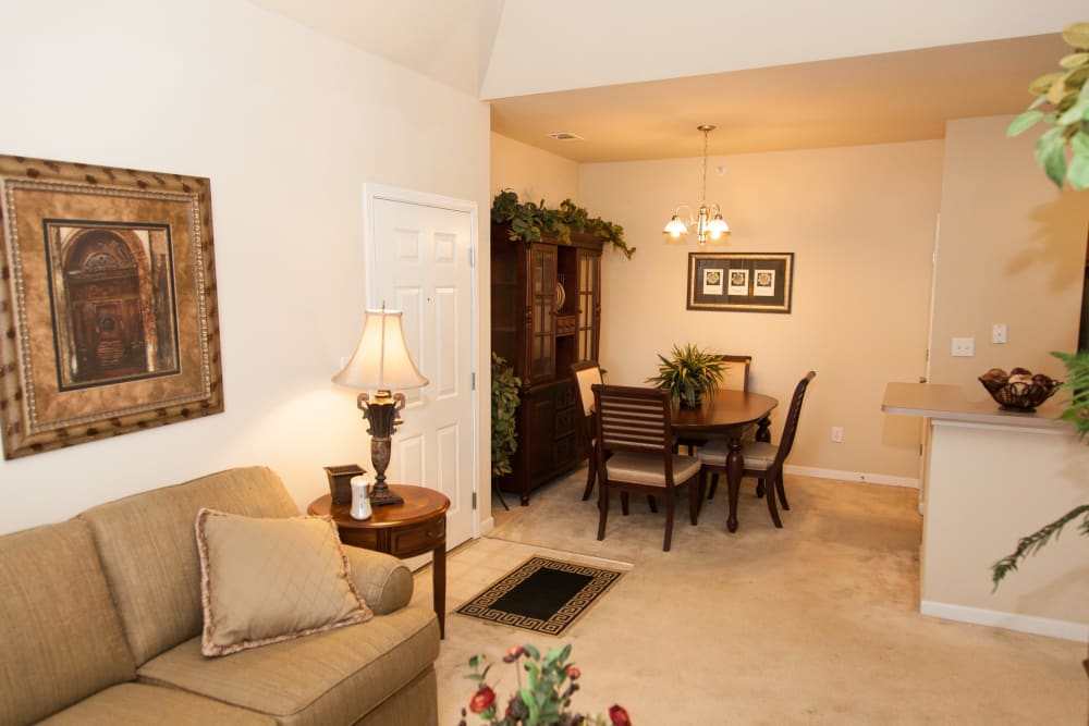 A large living room with plush carpeting at Peine Lakes in Wentzville, Missouri