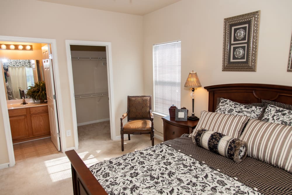 A master bedroom with plush carpeting at Peine Lakes in Wentzville, Missouri