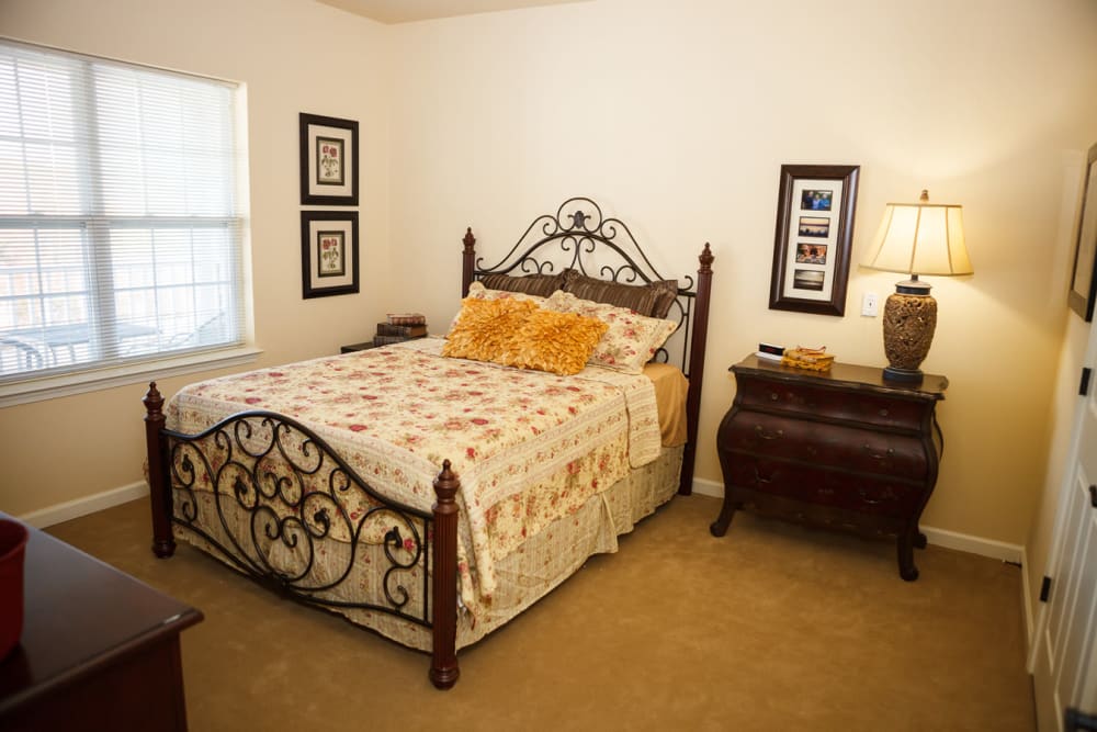 A spacious, furnished bedroom at Harmony at Falls Run in Fredericksburg, Virginia