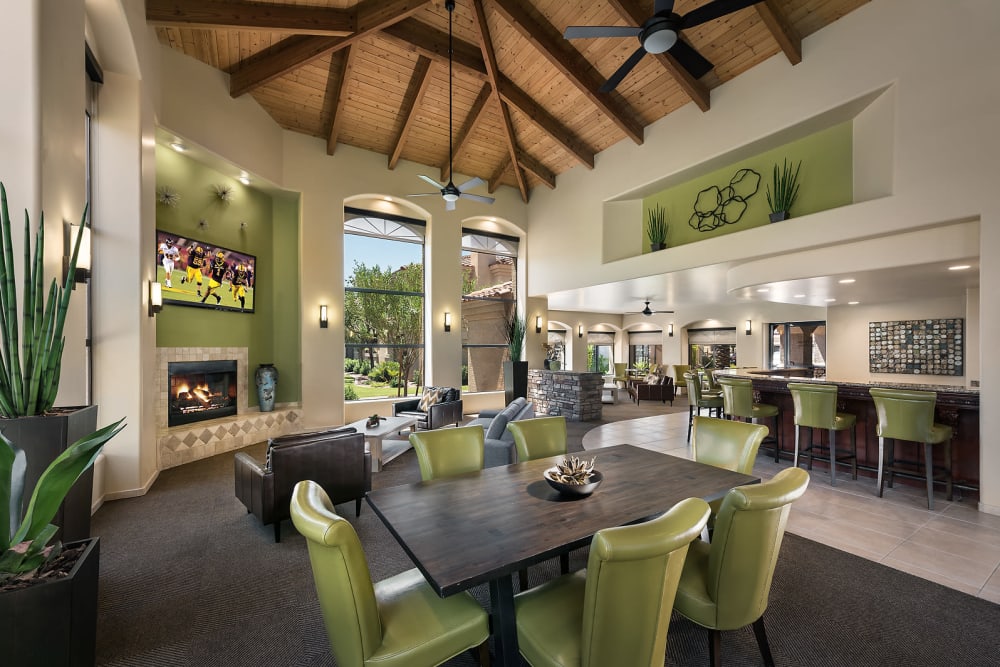 Luxurious clubhouse with a TV and fireplace at San Pedregal in Phoenix, Arizona