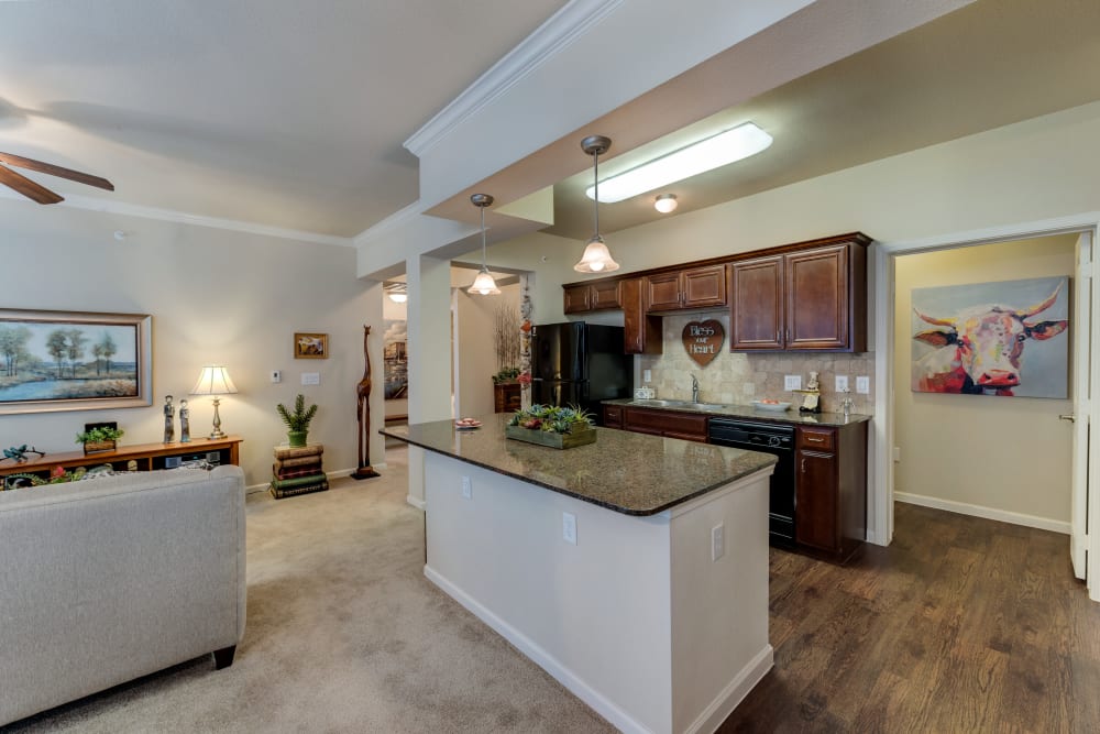A kitchen with island table at Watercrest at Bryan in Bryan, Texas