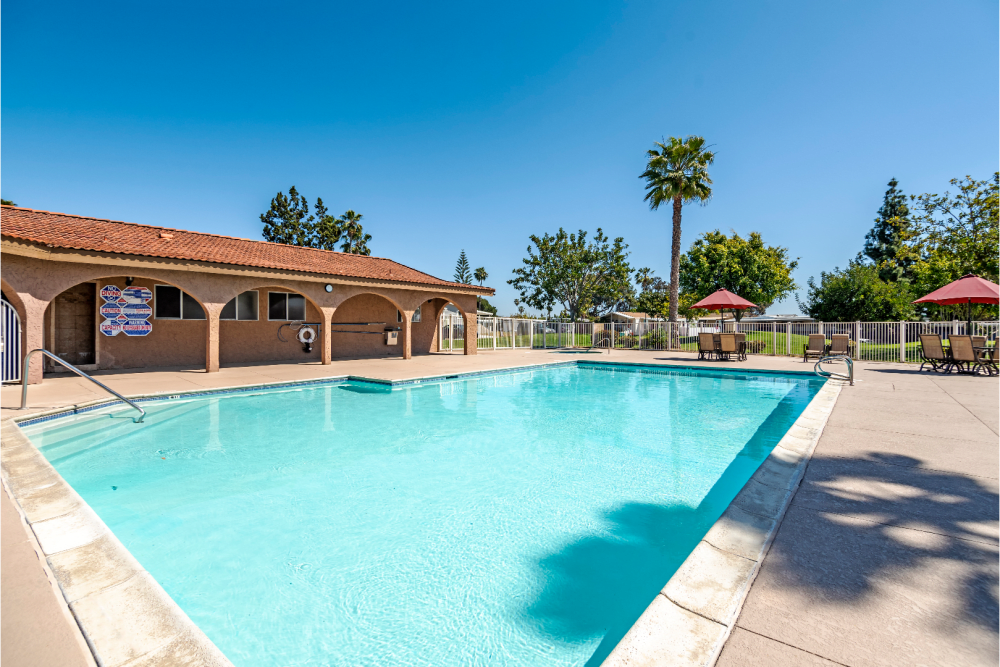 The swimming pool on a sunny day at Linda Vista Village in San Diego, California