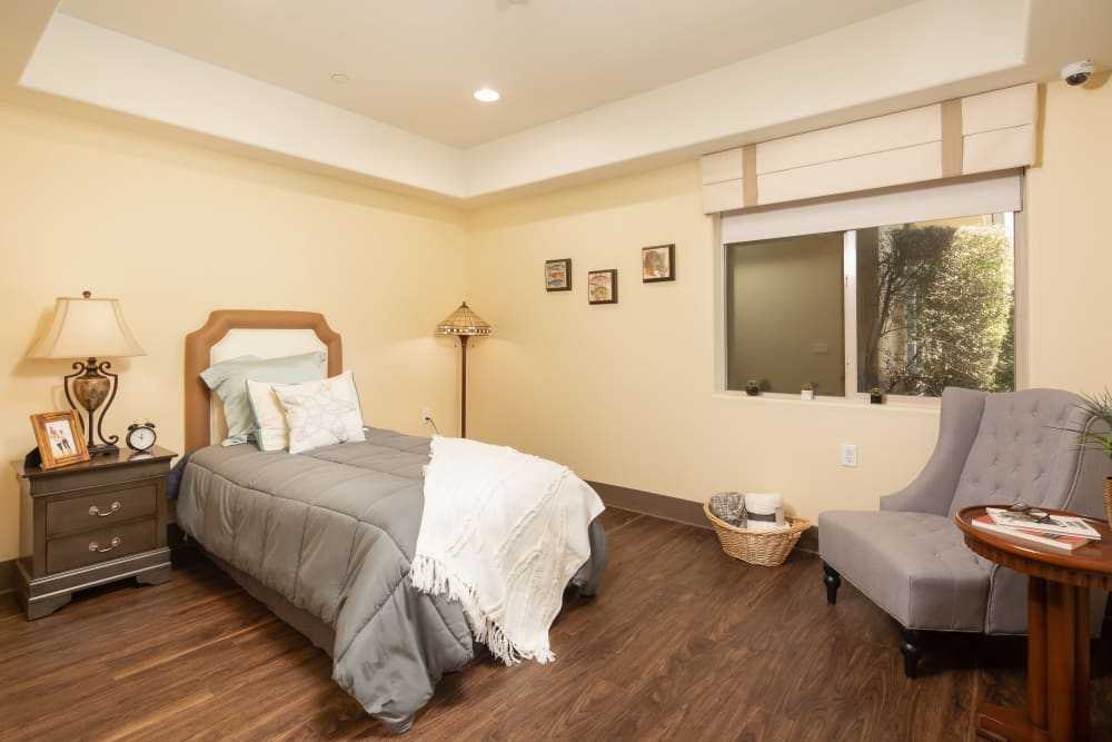 Bedroom in a model unit at Vista Gardens in Vista, California