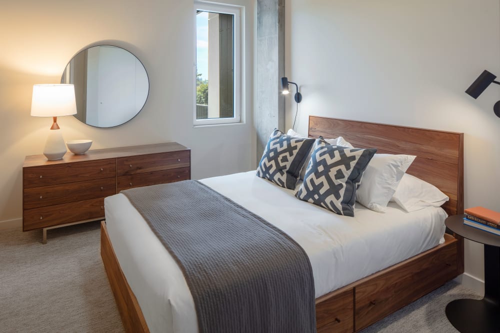 Well-decorated and spacious master bedroom in a model home at TwentyTwenty Apartments in Portland, Oregon