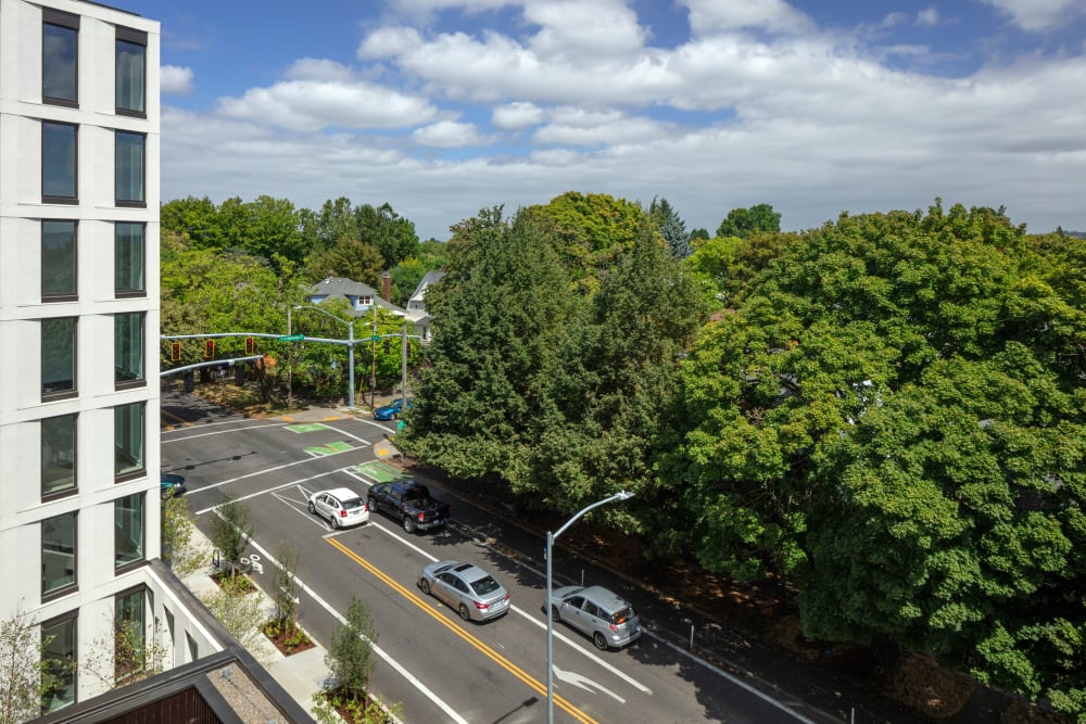 Beautiful view of the greenbelt across the street from an upper-floor home at TwentyTwenty Apartments in Portland, Oregon