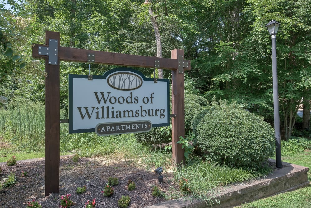 Entry Signage at Woods of Williamsburg Apartments in Williamsburg, Virginia