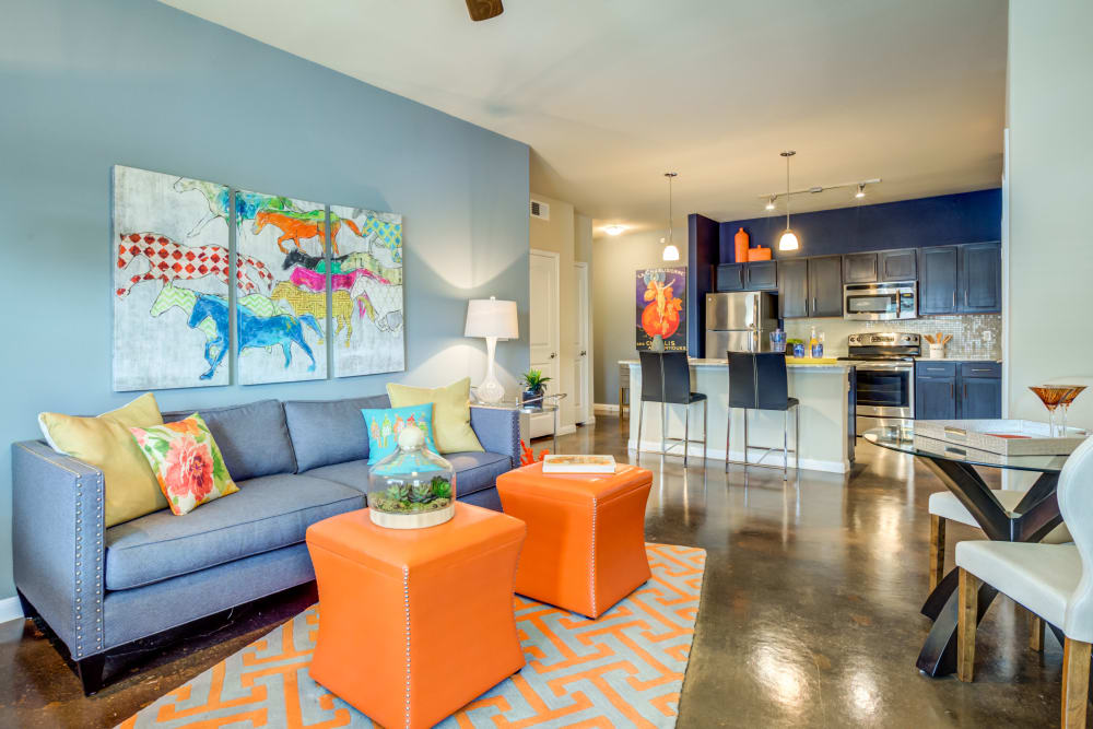 Beautiful and brightly decorated living room and kitchen area at Legacy Brooks in San Antonio, Texas