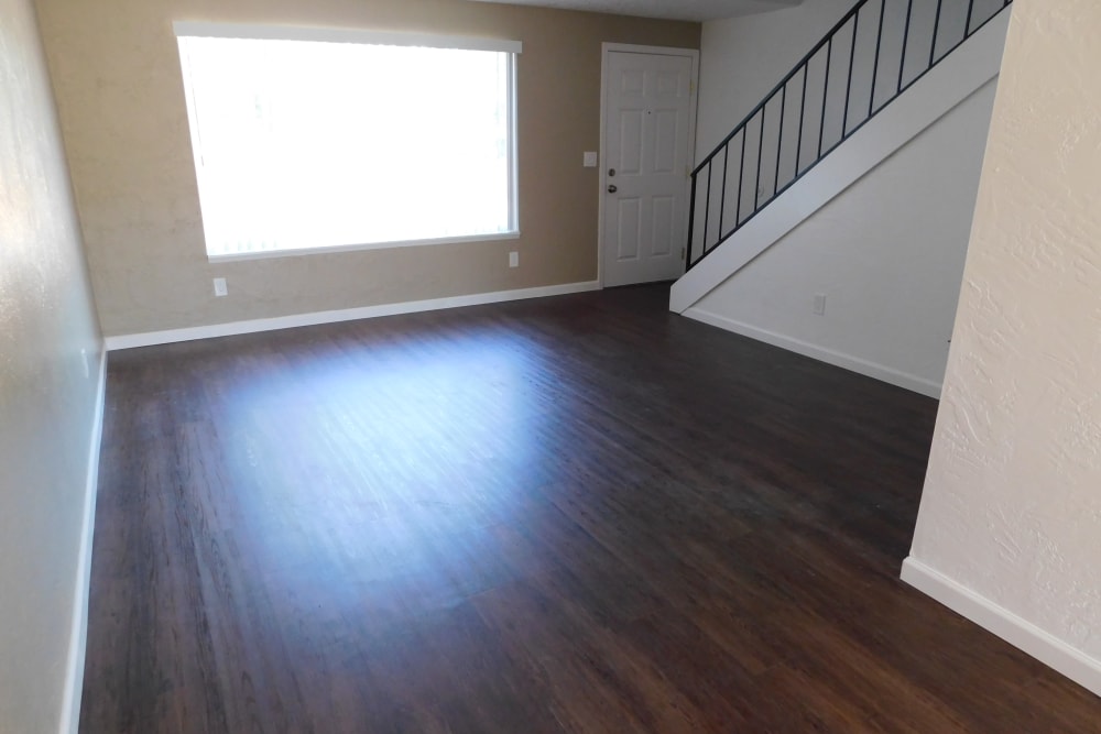 Living room with hardwood flooring at Lakeside Apartments in Albany, Oregon