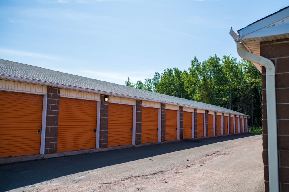 Orange doors on outside units at Apple Self Storage - Dieppe in Dieppe, New Brunswick