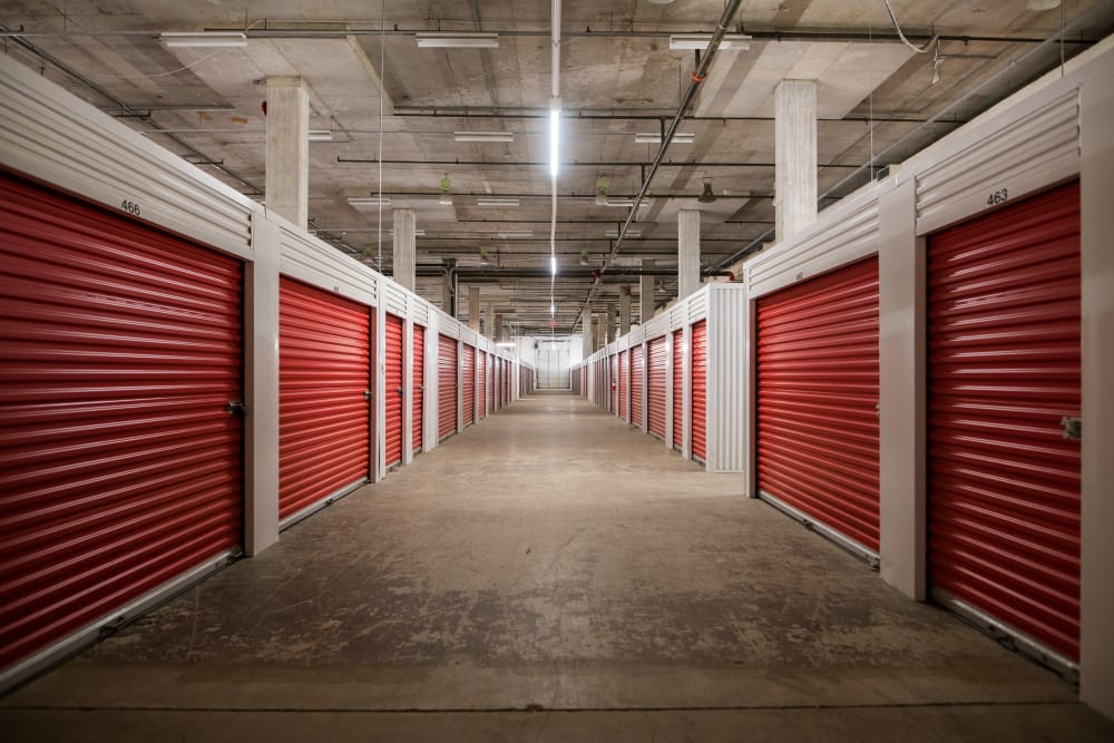 Red doors on the interior storage units at Apple Self Storage - Halifax Westend in Halifax, Nova Scotia