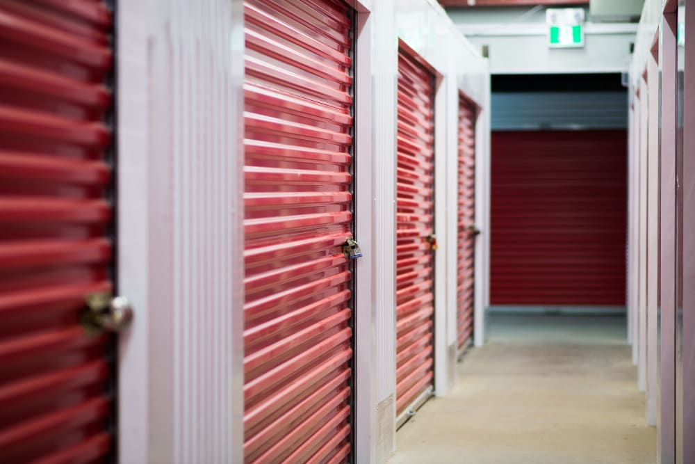 Interior units with bright red doors at Apple Self Storage - Saint John East in Saint John, New Brunswick