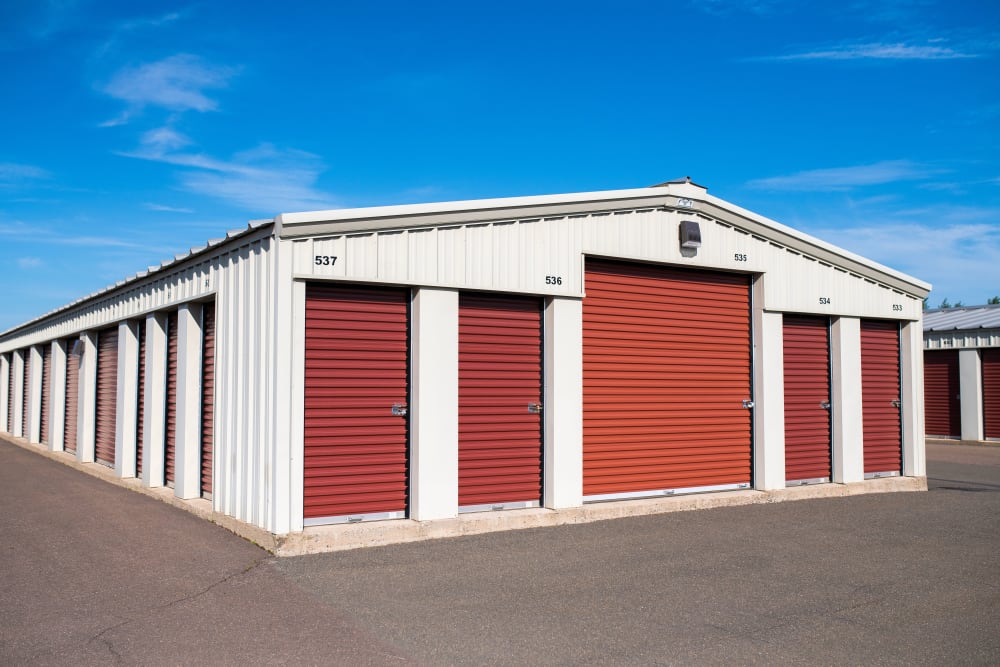 Red doors on the exterior units at Lighthouse Self Storage in Moncton, New Brunswick