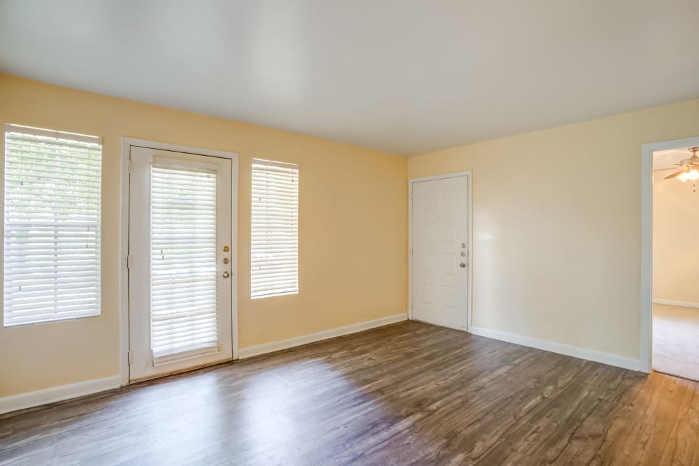 Wood-style flooring in an apartment at Woodcreek Apartments in Huntsville, Texas