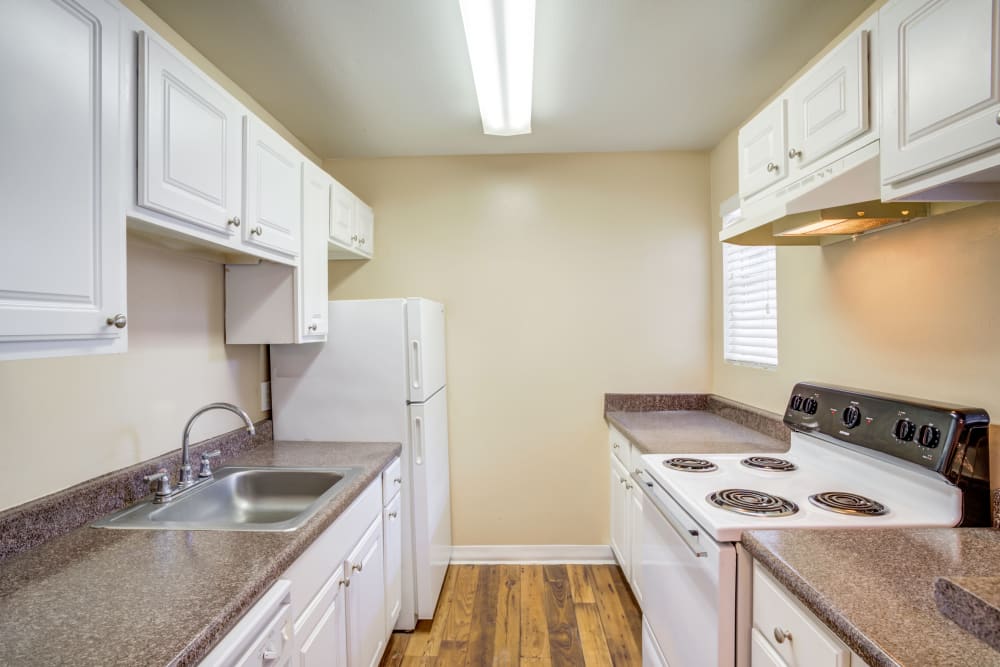 Model kitchen at Woodcreek Apartments in Huntsville, Texas