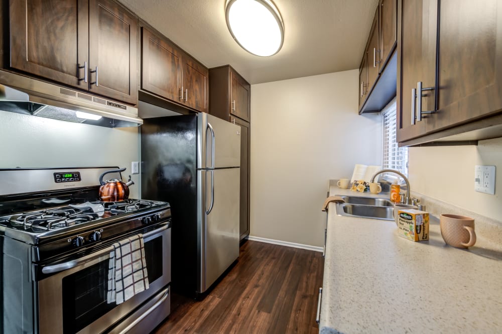 Brown kitchen with stainless steel appliances