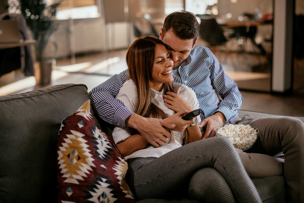 Residents cuddling on their couch at Deer Valley in Guilderland, New York