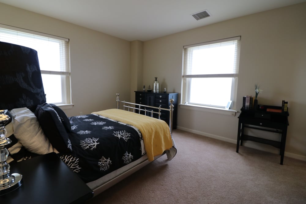 A bedroom at The Chamberlin well lit by sunlight in Hampton, Virginia