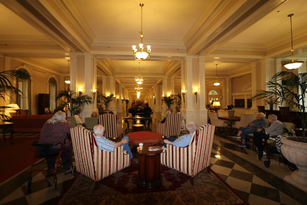 The piano is played for a crowd at The Chamberlin in Hampton, Virginia