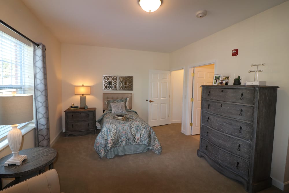 The bedroom of a resident at The Harmony Collection at Roanoke - Assisted Living in Roanoke, Virginia