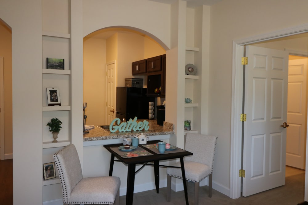 A view from the living room into the kitchen of a residence at The Harmony Collection at Roanoke - Assisted Living in Roanoke, Virginia