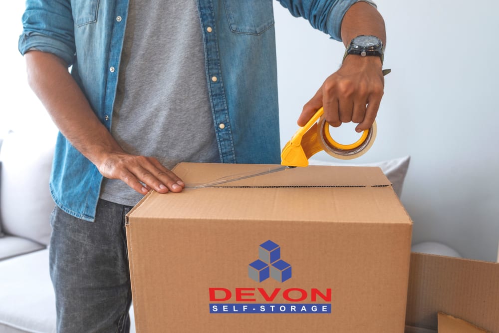 Box being packed to be stored at Devon Self Storage