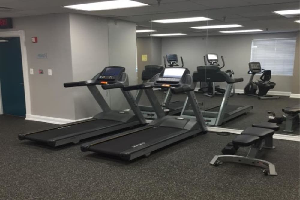 A fitness center with individual workout stations at 770 C Street Apartments in Washington, District of Columbia
