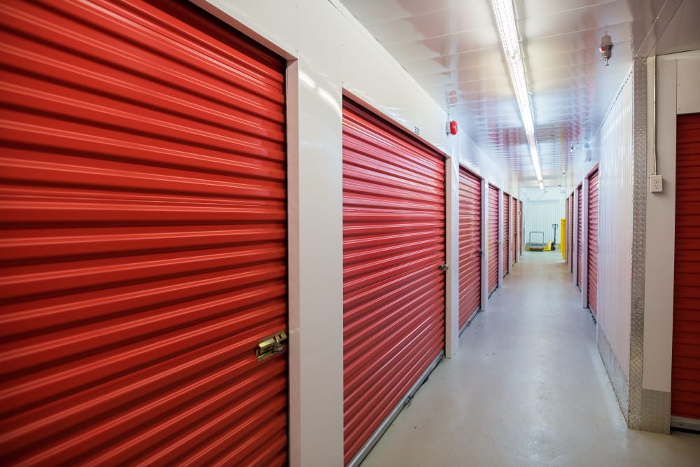 Red doors on interior units at Apple Self Storage - Saint John North in Saint John, New Brunswick