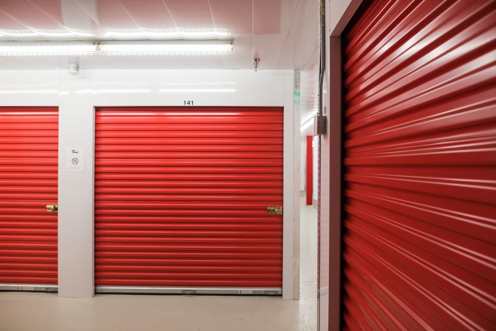 Red doors on units at Apple Self Storage - Saint John North in Saint John, New Brunswick