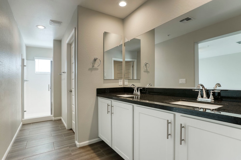 Upgraded luxury bathroom with a large vanity mirror at BB Living at Eastmark in Mesa, Arizona